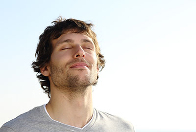 man enjoying breath