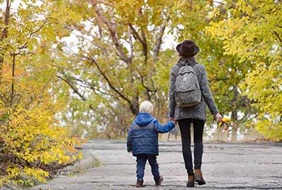 mom and son walking